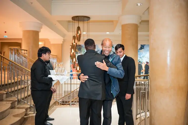 Guests greeting one another in the hotel foyer at the Black Pharma fifth anniversary gala.