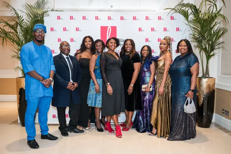Large group portrait at the Black Pharma step-and-repeat at the Black Pharma fifth anniversary gala.