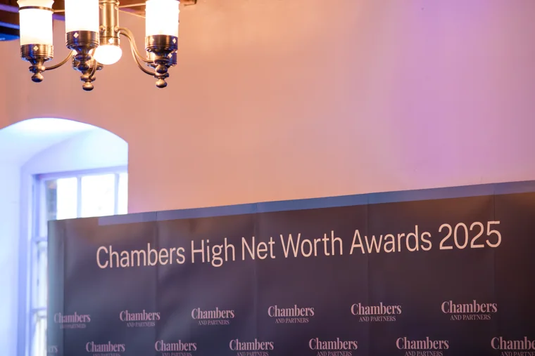 Chambers High Net Worth Awards 2025 branding beneath a wall light at the Chambers High Net Worth Awards 2025.