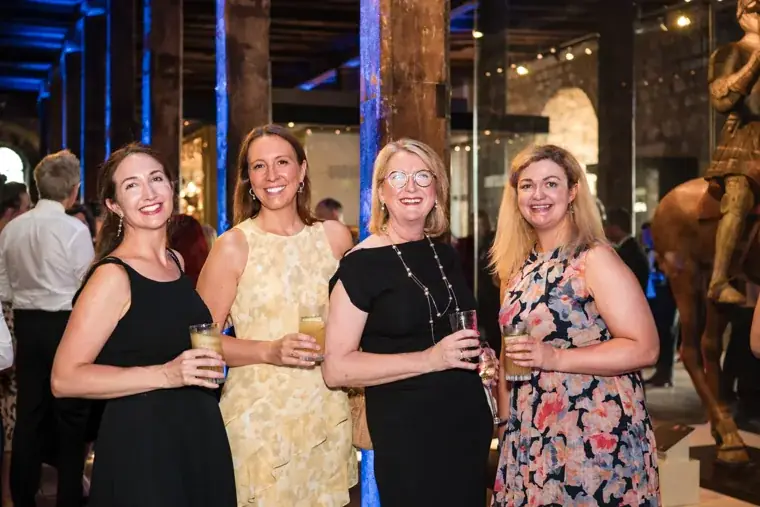 Four guests posing together in evening dresses at the Chambers High Net Worth Awards 2025.