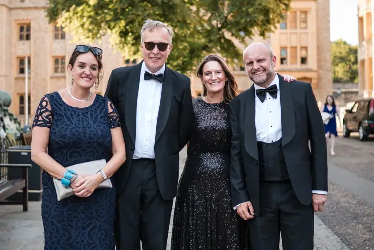 Four guests posing together with the Tower buildings behind them at the Chambers High Net Worth Awards 2025.