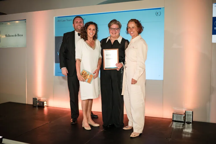 Four guests posing with an award certificate on stage at the Chambers High Net Worth Awards 2025.