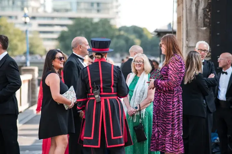 Guests gathering around a Yeoman Warder outside the Tower at the Chambers High Net Worth Awards 2025.