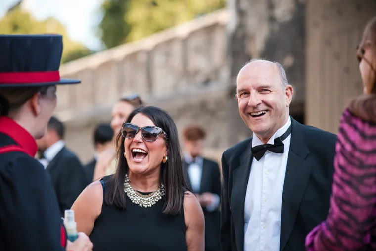 Guests laughing during an outdoor conversation with a Yeoman Warder at the Chambers High Net Worth Awards 2025.