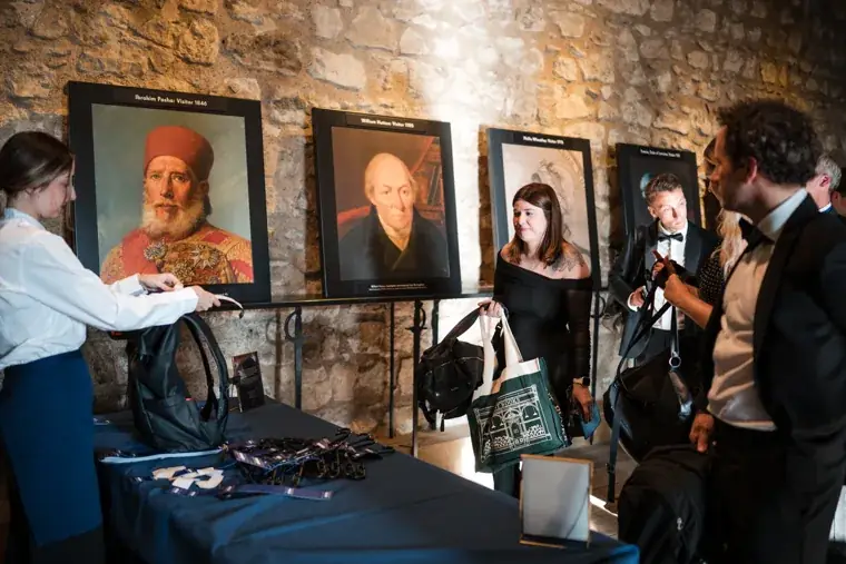 Guests viewing portrait artwork at the reception at the Chambers High Net Worth Awards 2025.