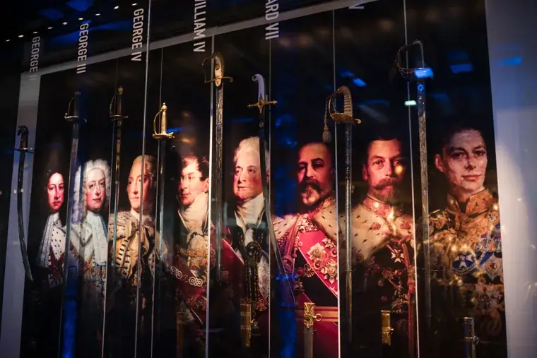 Illuminated historic portraits inside the exhibition space at the Chambers High Net Worth Awards 2025.