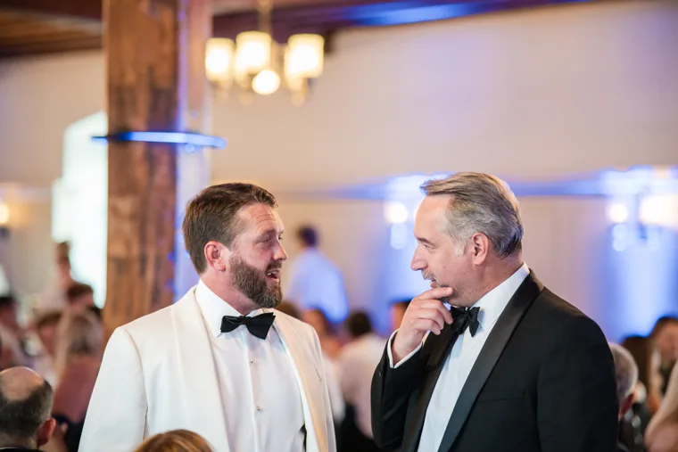 Two guests chatting across the dinner table at the Chambers High Net Worth Awards 2025.