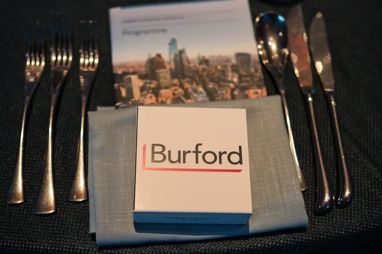 A Burford sponsor place card on a set dinner table at the Chambers UK Awards winter edition.