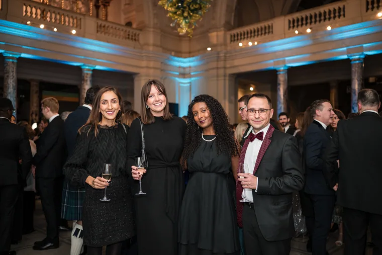 A group of guests posing with drinks at the Chambers UK Awards winter edition.