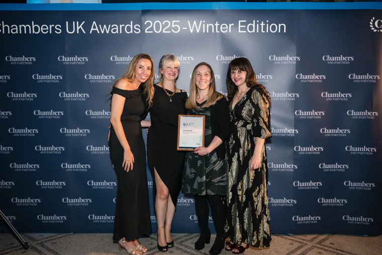 A group of women posing with their award at the Chambers UK Awards winter edition.