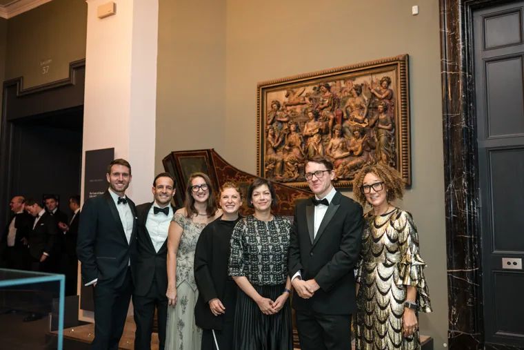 A group posing inside the museum gallery at the Chambers UK Awards winter edition.