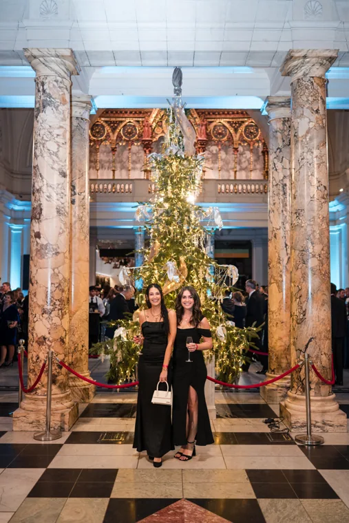 A guest standing beneath the venue's ornate stonework at the Chambers UK Awards winter edition.