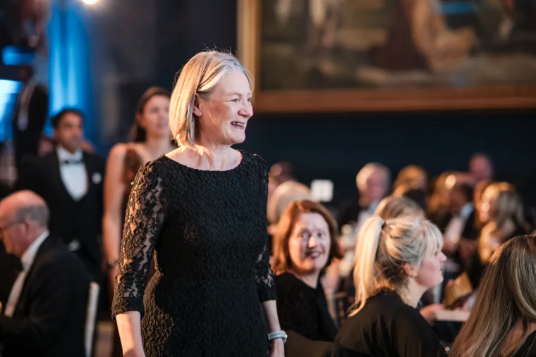 A guest walking through the applauding audience at the Chambers UK Awards winter edition.