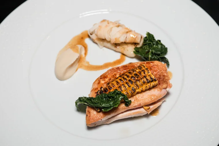 A plated dinner course on a white table at the Chambers UK Awards winter edition.