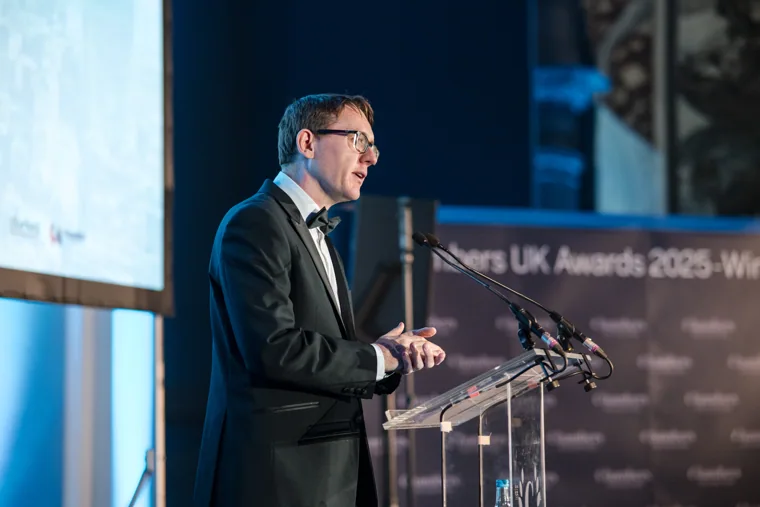 A speaker addressing the audience from the lectern at the Chambers UK Awards winter edition.