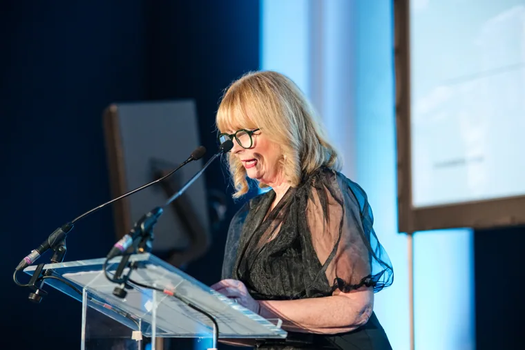 A woman speaking at the lectern at the Chambers UK Awards winter edition.