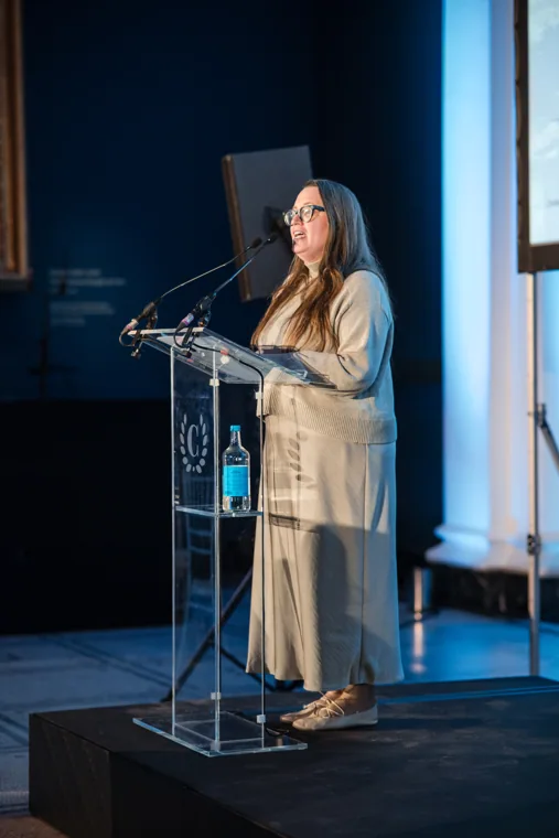 A woman speaking from the awards lectern at the Chambers UK Awards winter edition.