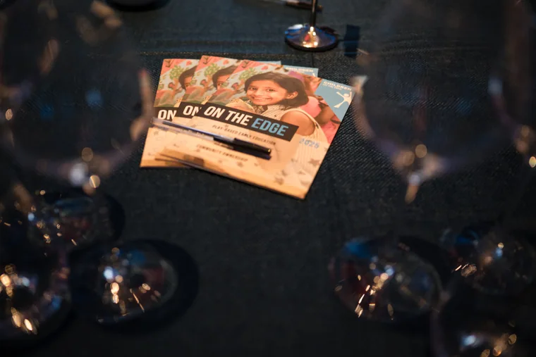 An event ticket laid out among the glassware at the Chambers UK Awards winter edition.