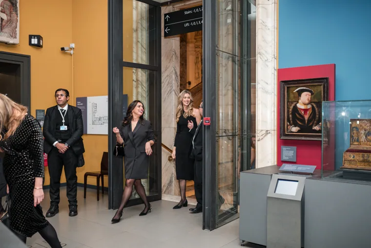 Guests passing a painting in the museum gallery at the Chambers UK Awards winter edition.