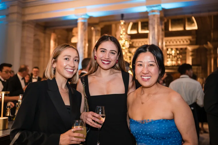 Three women smiling together at the reception at the Chambers UK Awards winter edition.