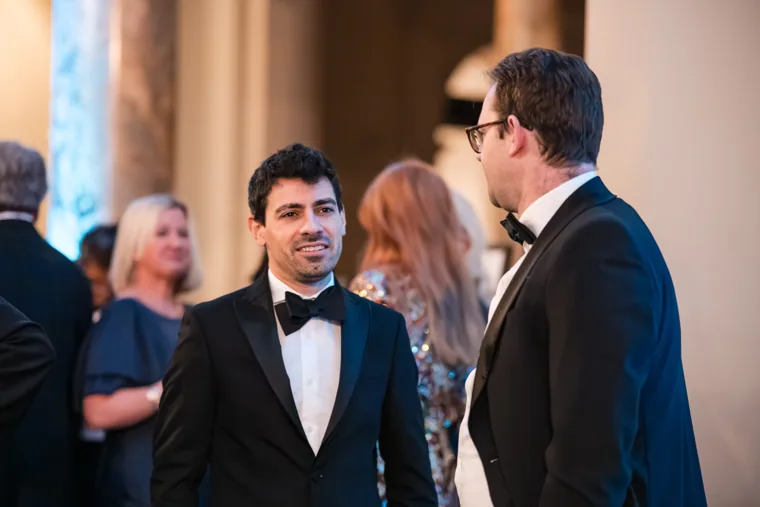 Two men talking at the reception at the Chambers UK Awards winter edition.