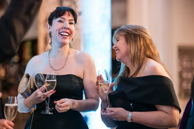 Two women sharing a conversation at the reception at the Chambers UK Awards winter edition.