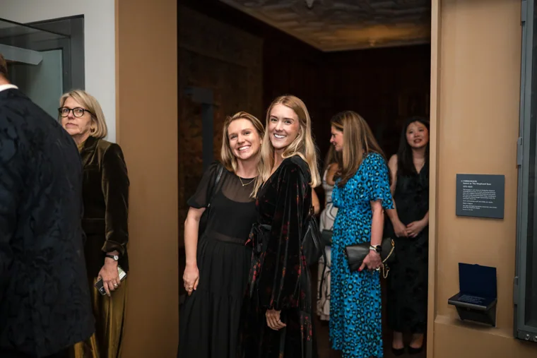 Women arriving through the museum doorway at the Chambers UK Awards winter edition.