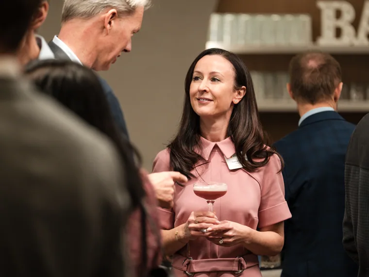 A guest making a point during a conversation at the Goodwin networking event.