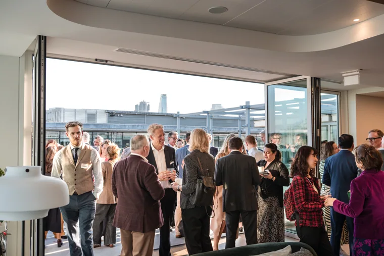 A busy moment during the indoor reception at the Goodwin networking event.