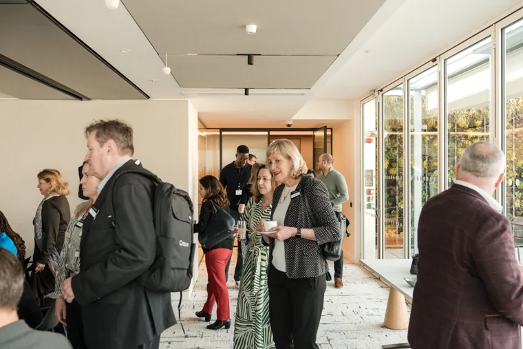 Guests entering the reception room at the Goodwin networking event.