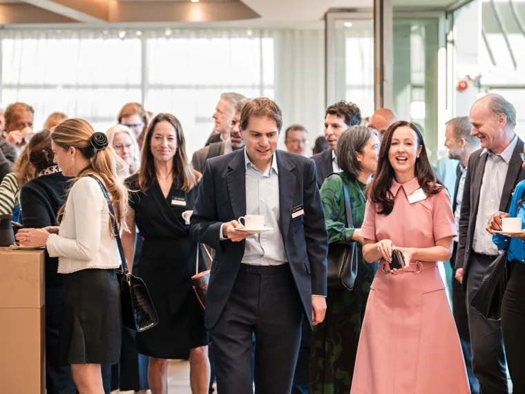 Guests arriving in the networking area at the Goodwin networking event.