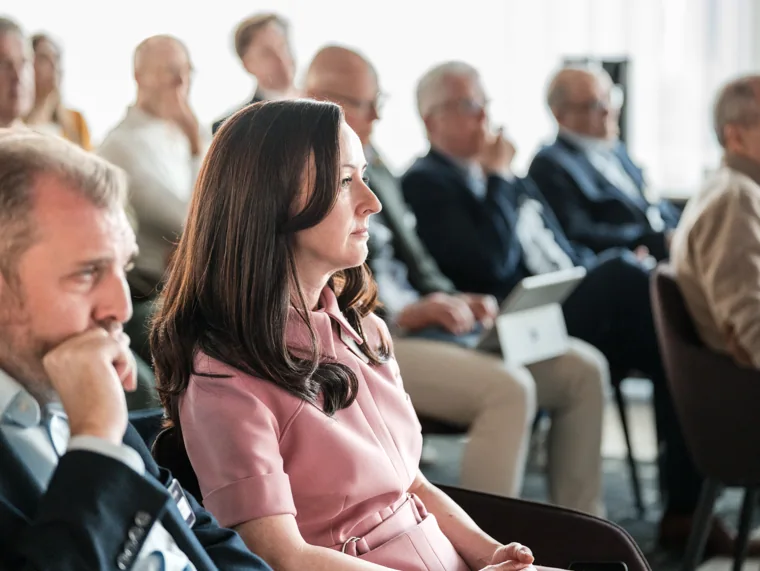 An audience member listening during a session at the Goodwin networking event.