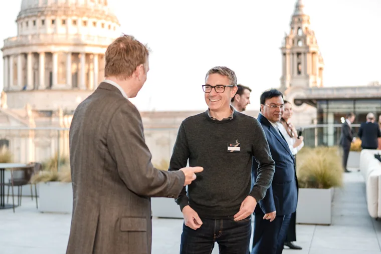 Guests chatting on the terrace at the Goodwin networking event.