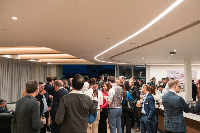 A wide view of the networking reception at the Goodwin networking event.