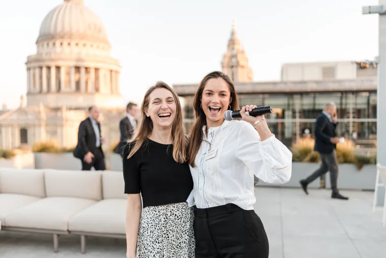 Two guests pictured on the terrace with St Paul’s Cathedral behind them at the Goodwin networking event.
