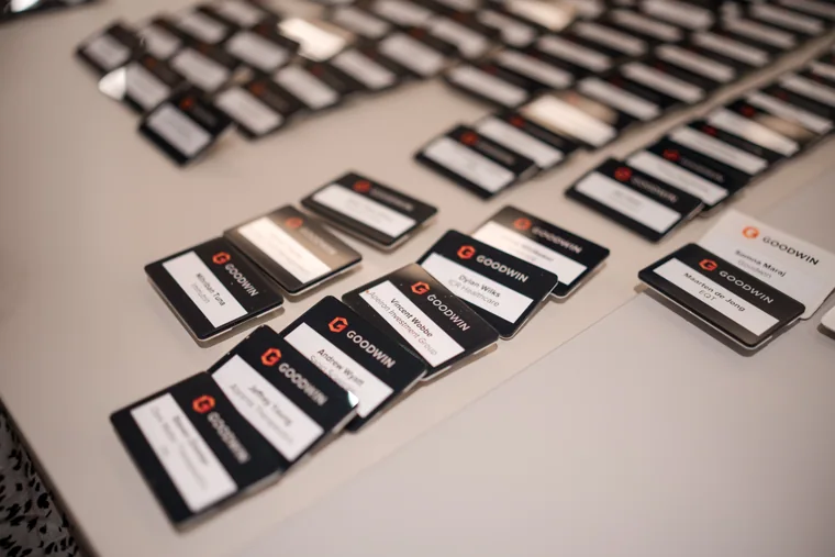 Goodwin event name badges prepared for guests at the Goodwin networking event.