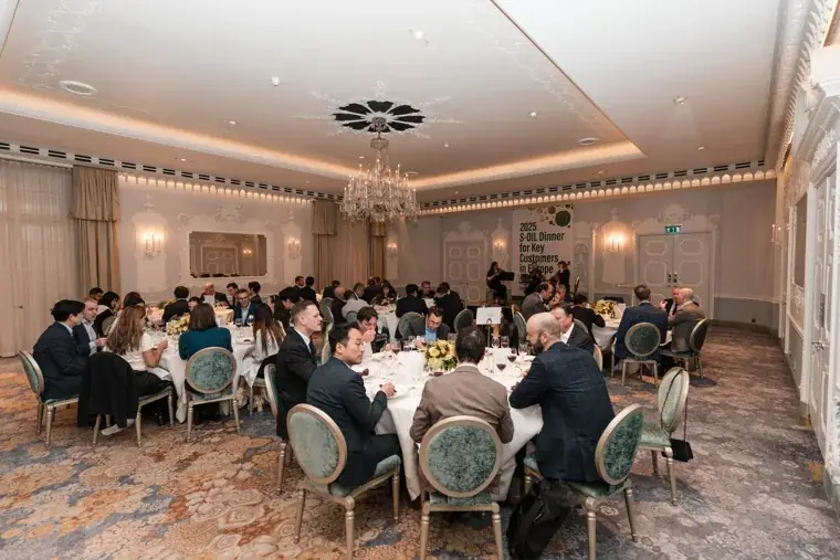 A wide view of the dinner room and guests at the S-OIL European customer dinner.