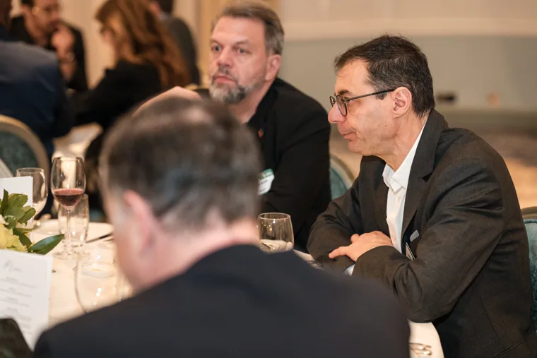 Guests sharing a conversation at the dinner table at the S-OIL European customer dinner.