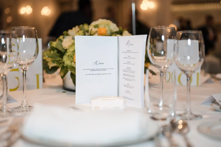 Table flowers and place settings before dinner at the S-OIL European customer dinner.