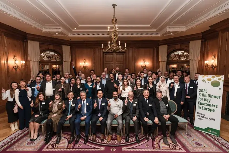 The full group posing at the European customer dinner at the S-OIL European customer dinner.