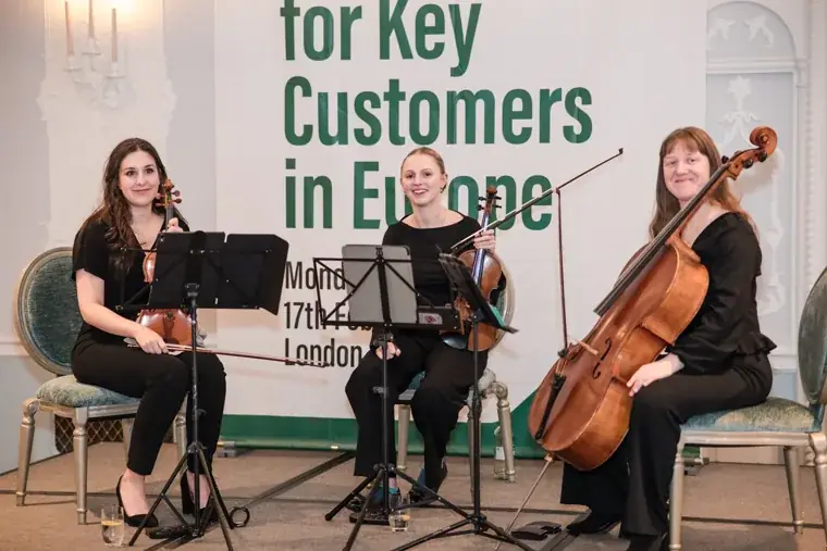 The musicians posing together after their performance at the S-OIL European customer dinner.