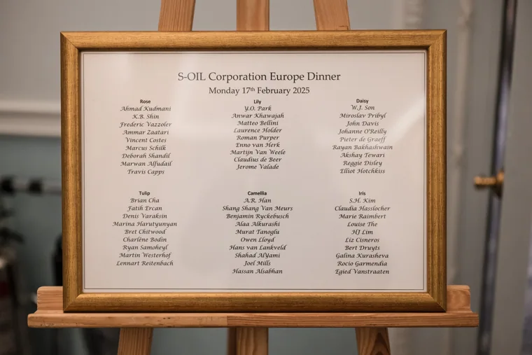 The printed dinner menu in a frame at the S-OIL European customer dinner.
