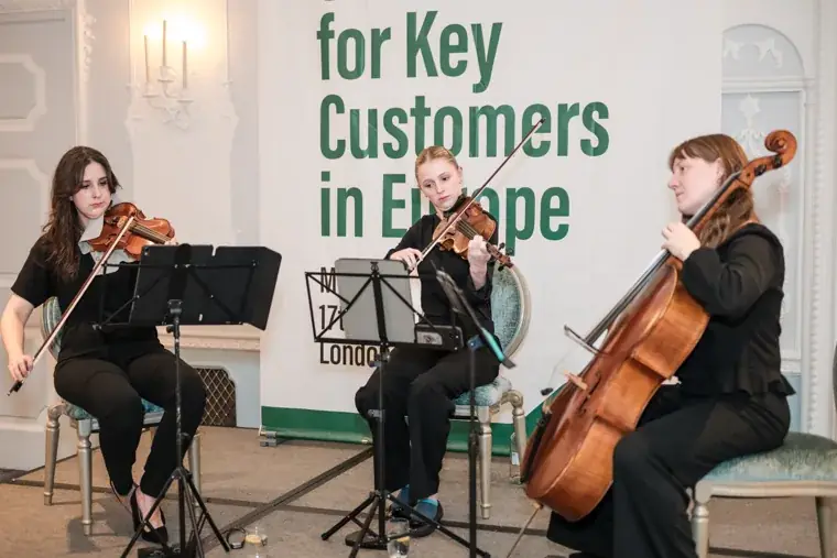 The string trio performing during dinner at the S-OIL European customer dinner.